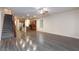 Bright and airy living room with wood-look floors connects to the kitchen at 10956 Hunting Hawk Rd, Las Vegas, NV 89179