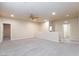 Spacious carpeted loft area with a ceiling fan and neutral colors that's perfect for relaxing or entertaining at 10956 Hunting Hawk Rd, Las Vegas, NV 89179