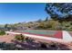 Picture of a basketball court, surrounded by trees and other landscape features, in a residential neighborhood at 1401 Via Savona Dr, Henderson, NV 89052