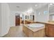 Bathroom showcasing a large tub, neutral tiling, and vanity areas at 1401 Via Savona Dr, Henderson, NV 89052