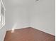 An empty bedroom features hardwood floors, white walls, and natural light at 1401 Via Savona Dr, Henderson, NV 89052