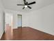 Bedroom with hardwood floors, white walls, and a walk in closet at 1401 Via Savona Dr, Henderson, NV 89052