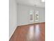 Bedroom with wood floors and double doors leading to the outside at 1401 Via Savona Dr, Henderson, NV 89052
