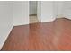 Bedroom with wood floors and an open closet at 1401 Via Savona Dr, Henderson, NV 89052