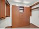 Walk-in closet with custom built-in shelves and hardwood floors at 1401 Via Savona Dr, Henderson, NV 89052