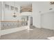 Spacious foyer featuring high ceilings, decorative railing, and neutral flooring at 1401 Via Savona Dr, Henderson, NV 89052