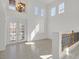 Grand foyer featuring high ceilings, a chandelier, and stylish double doors at 1401 Via Savona Dr, Henderson, NV 89052