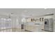 Modern kitchen with stainless steel appliances, an island, and marble countertops at 1401 Via Savona Dr, Henderson, NV 89052
