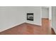 A cozy living room with a modern fireplace and wood floors at 1401 Via Savona Dr, Henderson, NV 89052