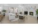 Cozy living room showcasing a fireplace, white sofa, and neutral decor at 1401 Via Savona Dr, Henderson, NV 89052