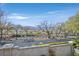 Mountain view from a balcony with wrought iron railing and mature trees at 1401 Via Savona Dr, Henderson, NV 89052