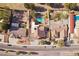 Aerial view of the home showcasing the backyard, swimming pool, and mature trees on a well-maintained lot at 1634 Georgia Ave, Boulder City, NV 89005
