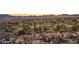 Overhead view of the beautiful community with mature trees, lush golf course, and mountains in the distance at 1634 Georgia Ave, Boulder City, NV 89005