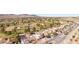Scenic aerial view of a lush community, desert landscaping, and a charming two-story home at 1634 Georgia Ave, Boulder City, NV 89005