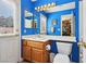 Brightly painted bathroom with a single vanity, and plenty of lighting and storage at 1634 Georgia Ave, Boulder City, NV 89005