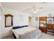 Comfortable bedroom with carpet floors, a ceiling fan, and wooden decorative shelving at 1634 Georgia Ave, Boulder City, NV 89005