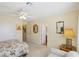 Bedroom featuring neutral walls, a floral bed, doorways, and a large lamp on a bedside table at 1634 Georgia Ave, Boulder City, NV 89005