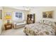 Cozy bedroom features a floral patterned bed, sofa, and natural lighting at 1634 Georgia Ave, Boulder City, NV 89005