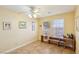 Neutral bedroom with tile floors, natural light, and wooden furniture at 1634 Georgia Ave, Boulder City, NV 89005