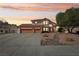 Gorgeous two-story home featuring a three-car garage, and desert landscaping for a modern curb appeal at 1634 Georgia Ave, Boulder City, NV 89005