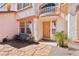 Charming home exterior with a decorative front door, stone pathway, and manicured landscaping at 1634 Georgia Ave, Boulder City, NV 89005