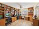 Dedicated home office features built-in bookshelves and dual workstations for productivity at 1634 Georgia Ave, Boulder City, NV 89005