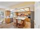 Well-lit kitchen featuring tile floors, stainless steel appliances, and an island with seating at 1634 Georgia Ave, Boulder City, NV 89005