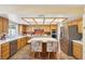 Well-lit kitchen with stainless steel appliances, tile countertops, and central island at 1634 Georgia Ave, Boulder City, NV 89005