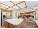 Open kitchen with stainless refrigerator and views to the living area and fireplace at 1634 Georgia Ave, Boulder City, NV 89005