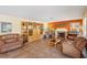 Spacious living room featuring a cozy fireplace, entertainment center and tile floors at 1634 Georgia Ave, Boulder City, NV 89005