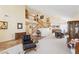 Open-concept living room with a staircase, tile flooring, and neutral colors at 1634 Georgia Ave, Boulder City, NV 89005