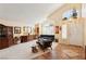 Bright and airy living room with vaulted ceilings, neutral colors, and a cozy seating area at 1634 Georgia Ave, Boulder City, NV 89005