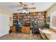 Home office features a tiled floor, built in desks and cabinetry and plenty of shelving at 1634 Georgia Ave, Boulder City, NV 89005