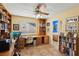 Spacious home office with built-in bookshelves, desk, and access to a bathroom at 1634 Georgia Ave, Boulder City, NV 89005