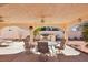 Inviting covered patio with ceiling fan, dining set, outdoor kitchen, and views of the backyard at 1634 Georgia Ave, Boulder City, NV 89005
