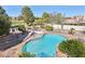 Aerial view of the backyard pool, spa, lush landscaping, and privacy at 1634 Georgia Ave, Boulder City, NV 89005