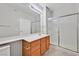 Bathroom with a large mirror, single vanity, and glass-enclosed shower, providing a functional space at 1830 N Buffalo Dr # 1029, Las Vegas, NV 89128