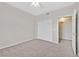 Bright bedroom featuring neutral carpet, a ceiling fan, and a sliding-door closet at 1830 N Buffalo Dr # 1029, Las Vegas, NV 89128