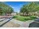 Community courtyard with picnic tables and green space in a residential neighborhood at 1830 N Buffalo Dr # 1029, Las Vegas, NV 89128