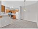 Spacious living area that seamlessly connects to the kitchen with stylish lighting, appliances, and ample cabinet space at 1830 N Buffalo Dr # 1029, Las Vegas, NV 89128