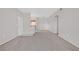 A well-lit open-concept living space with neutral walls that seamlessly connects to the kitchen area at 1830 N Buffalo Dr # 1029, Las Vegas, NV 89128