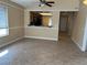 Inviting living area featuring views into the kitchen, a ceiling fan, and lots of natural light at 1836 Misty Glade Dr, Las Vegas, NV 89119