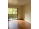 Bedroom with sliding door access to a patio with neutral paint colors at 1842 N Decatur Blvd # 101, Las Vegas, NV 89108