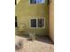 Building exterior with desert landscaping and a single window at 1842 N Decatur Blvd # 101, Las Vegas, NV 89108