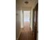 Hallway featuring hardwood floors leading to another room at 1842 N Decatur Blvd # 101, Las Vegas, NV 89108