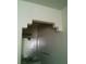 A partially-view of the bathroom with a large mirror, and silver hardware on the walls at 1851 Hillpointe Rd # 2112, Henderson, NV 89074