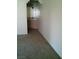 Hallway with a glimpse of a counter and cabinet at 1851 Hillpointe Rd # 2112, Henderson, NV 89074