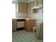 The kitchen has tiled floors, wooden cabinets, and white countertops, with modern appliances at 1851 Hillpointe Rd # 2112, Henderson, NV 89074