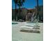 A view of the pool area with lounge chairs surrounding the pool deck with palm trees at 1851 Hillpointe Rd # 2112, Henderson, NV 89074