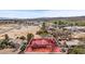 This aerial view shows a charming house outlined on a large property near desert landscape and distant mountains at 1951 Jim Haworth Ct, Logandale, NV 89021